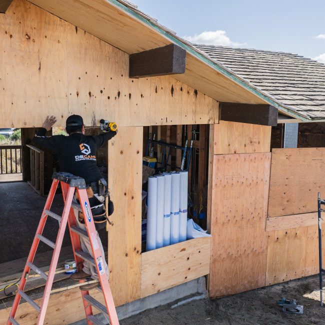 Residential exterior framing and sheathing installation in progress